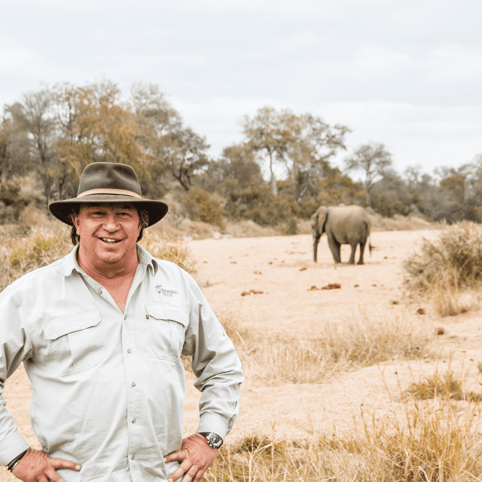 Ranger Buck Archie with elephant in background