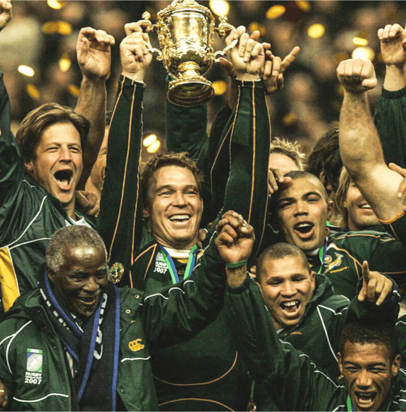 John Smit with Springboks celebrating 2007 Rugby World Cup victory with Thabo Mbeki