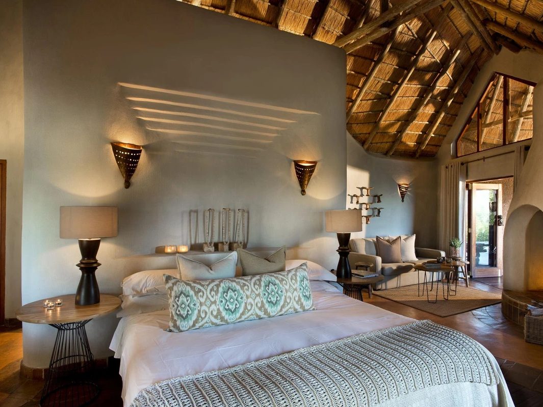 Thatched suite bedroom at Madikwe Safari Lodge