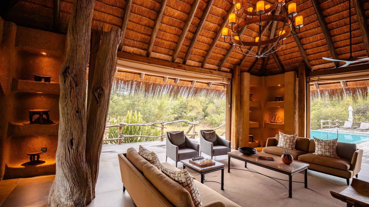 Thatched lounge and pool deck at Kapama River Lodge
