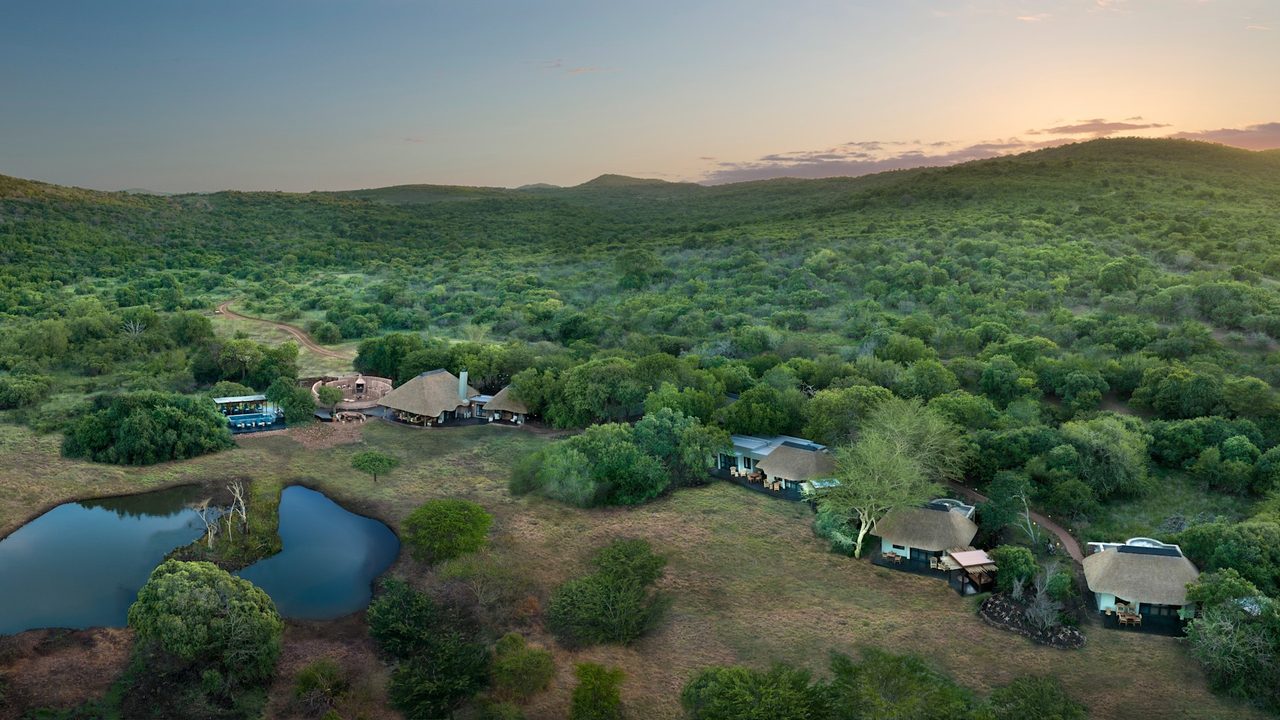 Aerial view of andBeyond Phinda Zuka Lodge in the KwaZulu-Natal bush at dusk