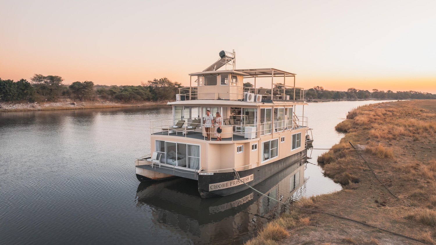 The Chobe Princess houseboat moored in a quiet channel of the Chobe River in the late afternoon