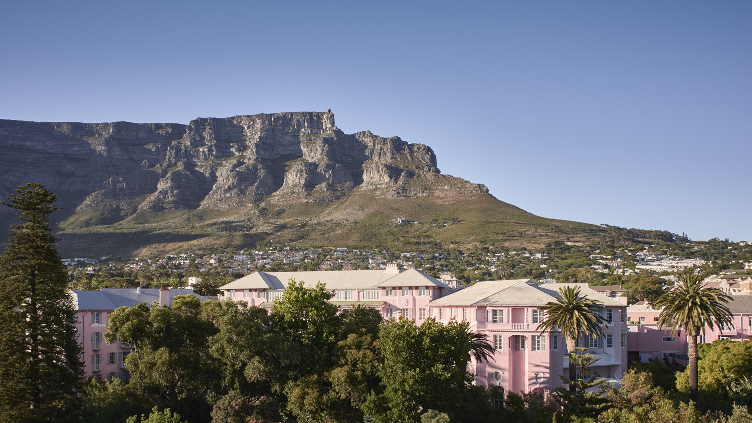 Table Mountain rising behind the Mount Nelson hotel and the gardens of Cape Town