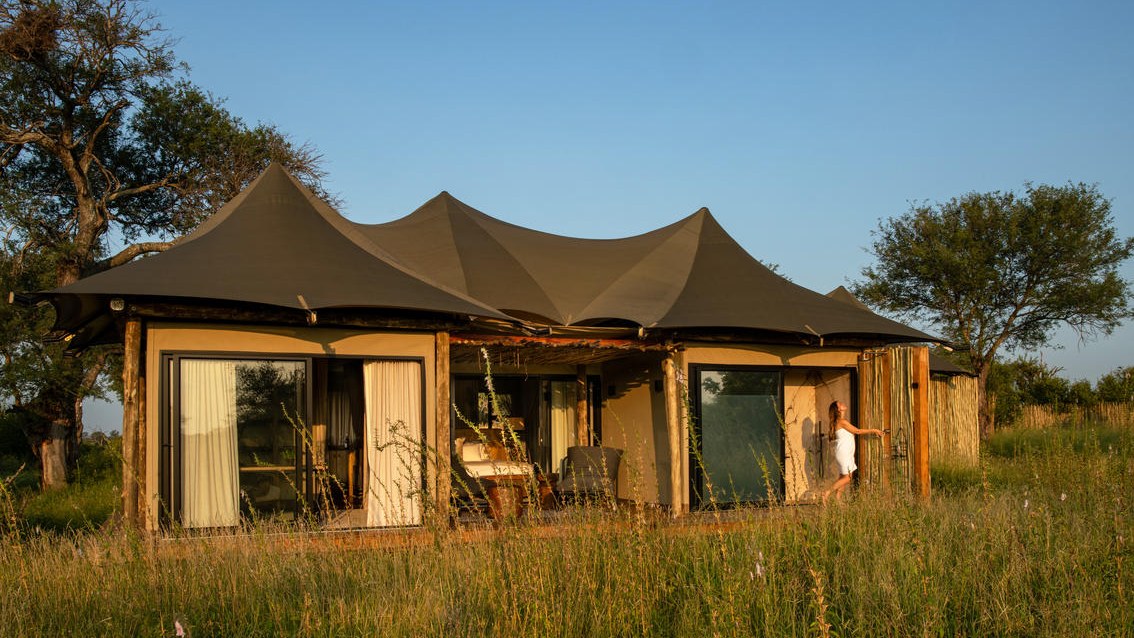 Tented suite at Amaya standing in long grass in the Timbavati Private Nature Reserve