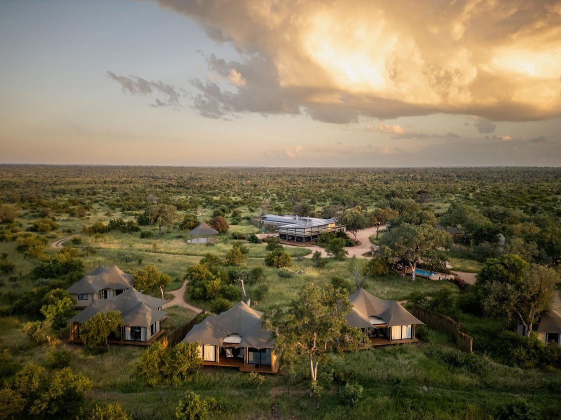 Aerial view of a thatched safari lodge in the Timbavati at sunset