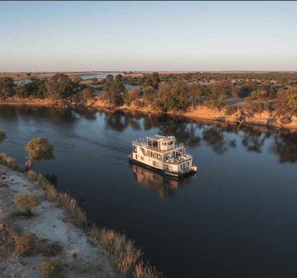 A houseboat on the Chobe River at last light